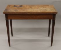 A 19th century mahogany fold-over tea table. 93.5 cm wide.