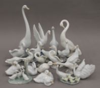 A collection of Lladro and NAO porcelain swans. The largest 34 cm high.