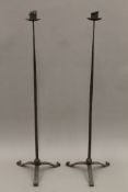 Two pairs of wrought iron candlesticks. The largest 150 cm high.