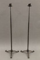 Two pairs of wrought iron candlesticks. The largest 150 cm high.