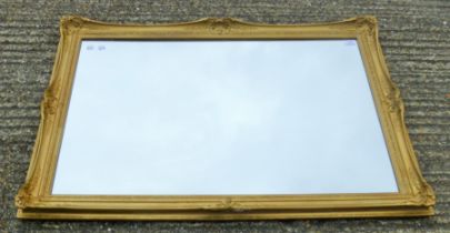 A large gilt-framed mirror. 115 x 87 cm.
