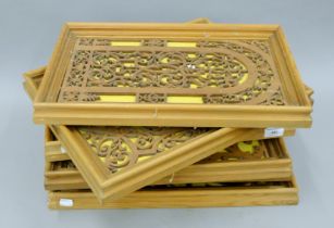 Six various fret carved wooden panels, each framed. The largest 35.5 x 45 cm.