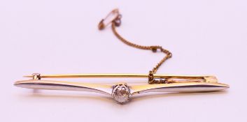 An unmarked gold and diamond bar brooch. 6 cm wide. 4.6 grammes total weight.