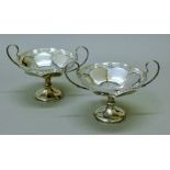 A pair of silver twin-handled tazzas. 18 cm wide. 387.6 grammes.