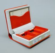 A bridge box formed as a book stamped Asprey. 13.5 cm wide.