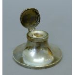 A silver capstan inkwell, hallmarked for Birmingham 1926.