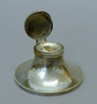 A silver capstan inkwell, hallmarked for Birmingham 1926.