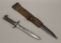 A Swedish bayonet with leather frog. 43 cm long overall.