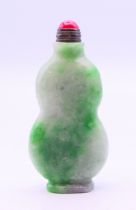 A jade snuff bottle and stopper. 7 cm high.