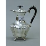 A silver teapot. 20.5 cm high. 413.6 grammes total weight.