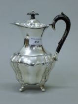A silver teapot. 20.5 cm high. 413.6 grammes total weight.