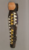An African painted wooden tribal mask. 53 cm high.