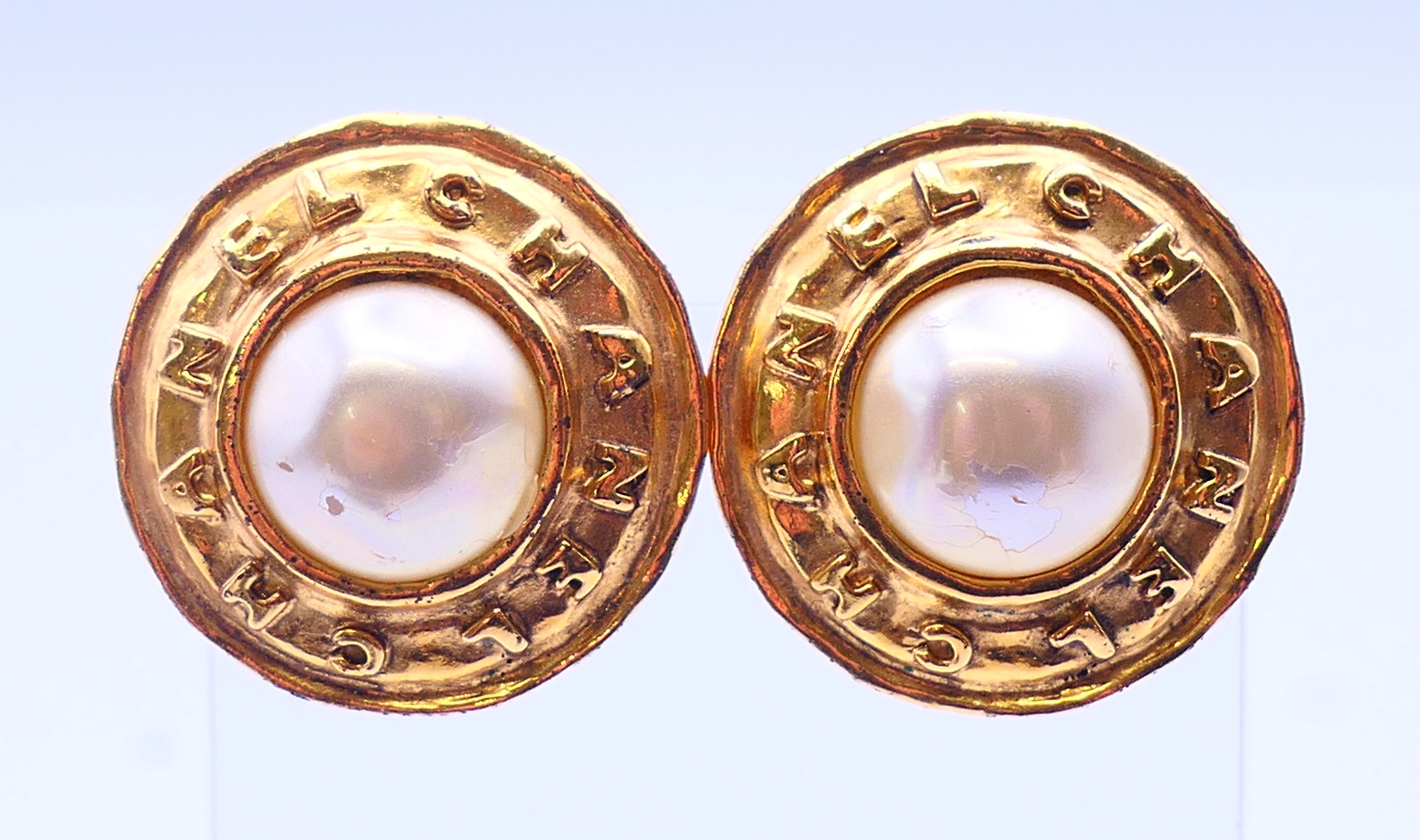 A pair of Chanel faux pearl clip-on earrings in a Chanel box, model number 2813. 3 cm diameter.