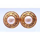 A pair of Chanel faux pearl clip-on earrings in a Chanel box, model number 2813. 3 cm diameter.