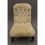 A Victorian button upholstered nursing chair. 59 cm wide.