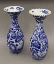 A pair of 19th century Japanese blue and white porcelain vases painted with birds etc,