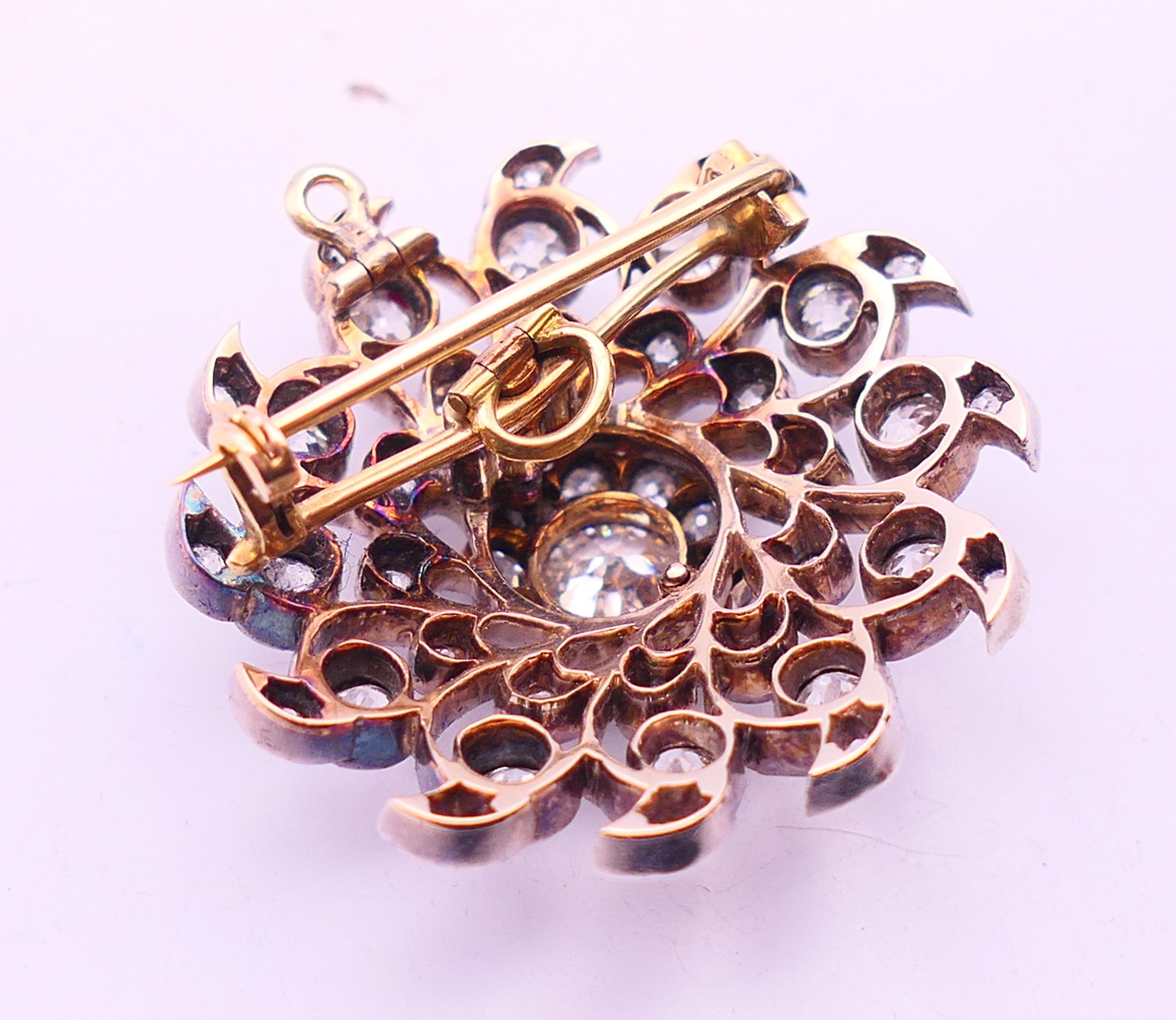 A pierced diamond pendant brooch, the centre stone spreading to approximately 0.75 of a carat. - Bild 3 aus 4
