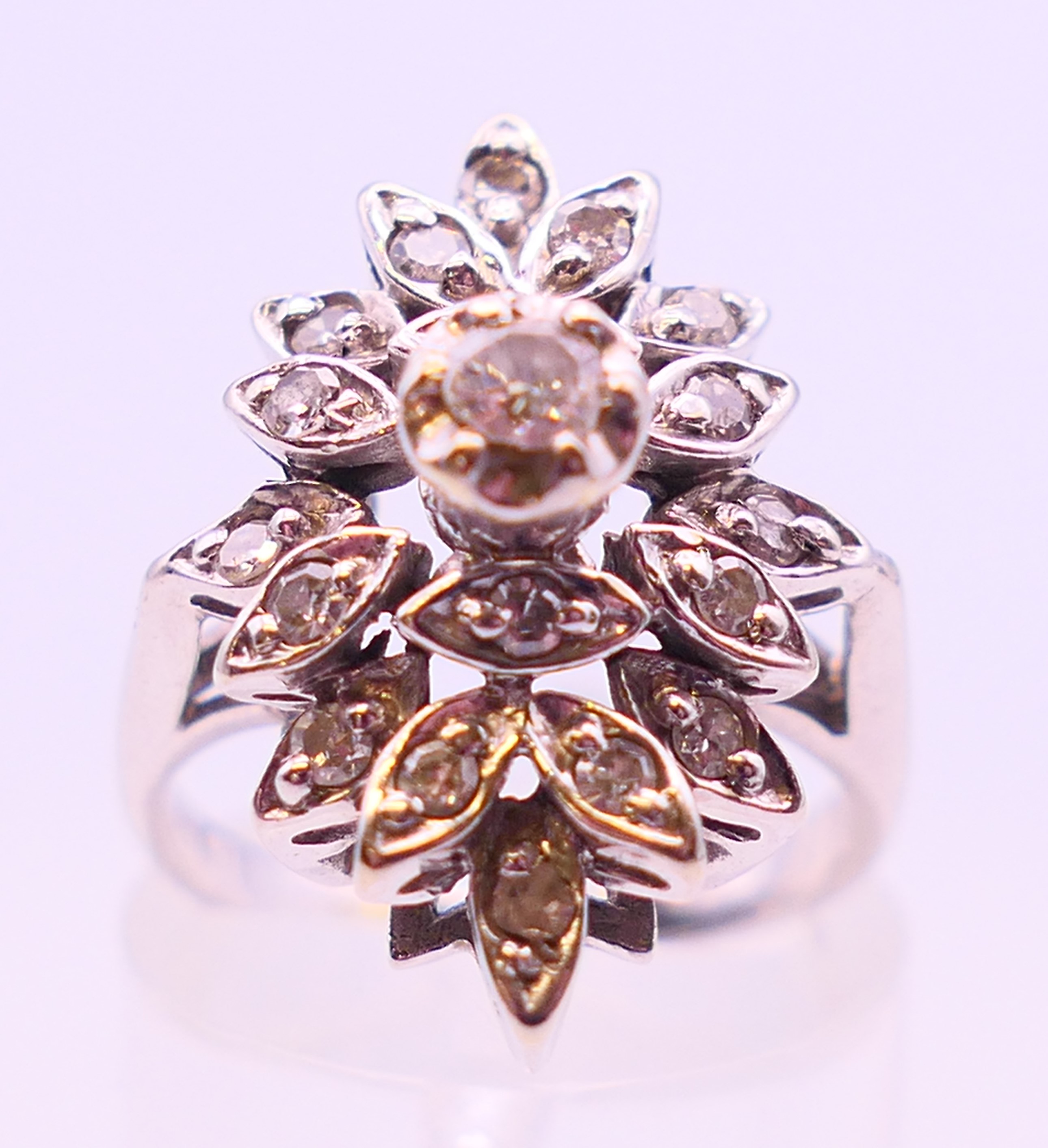 A platinum and diamond flowerhead ring. Ring size K/L. - Image 2 of 5