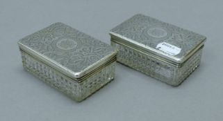 Two silver-lidded cut glass boxes. Each 9.5 cm long. 125.