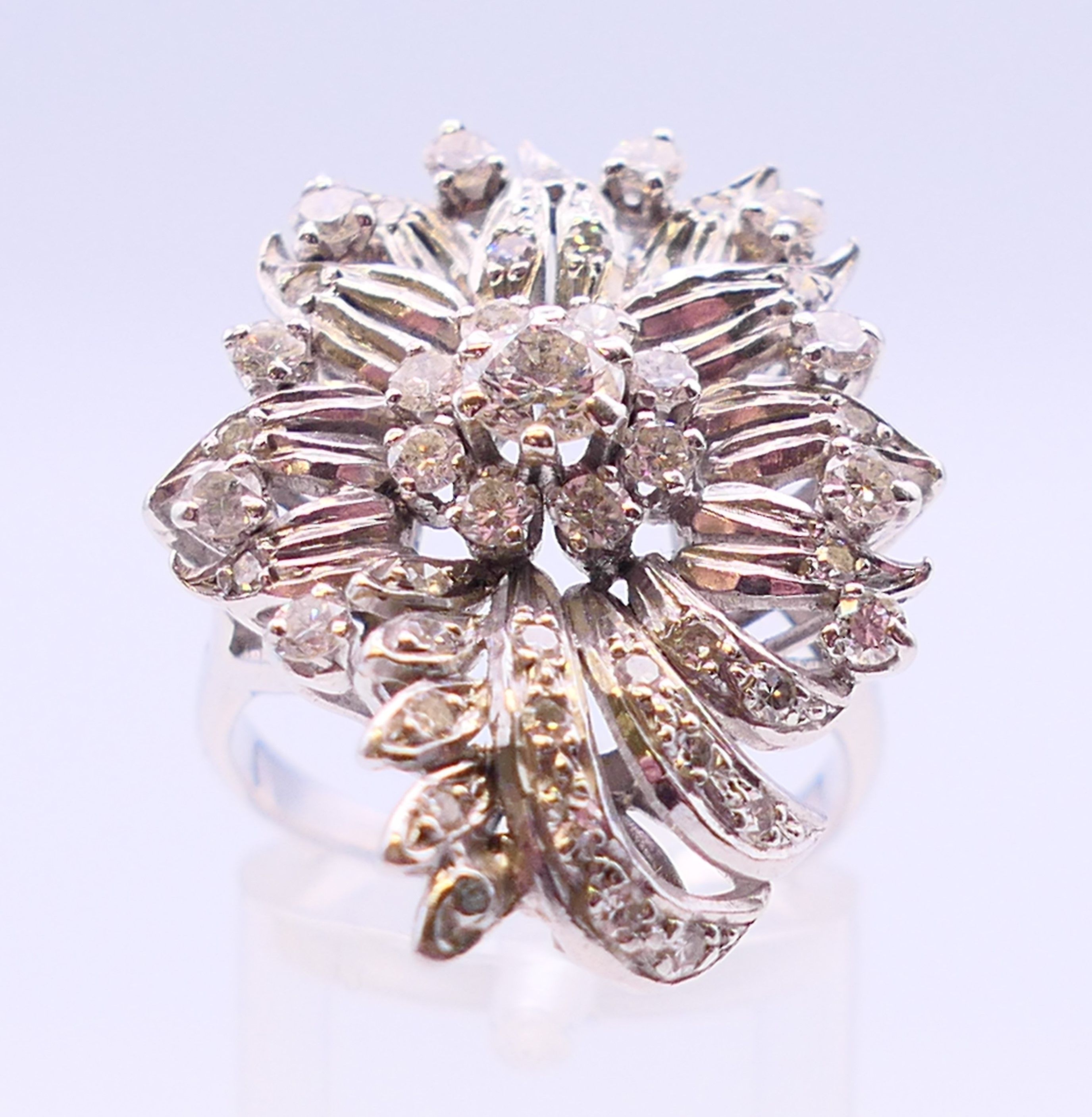 An unmarked platinum or white gold, diamond floral spray ring. 3cms long. Ring size Q/R. - Image 2 of 6