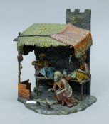 A cold-painted bronze of an Arab shop. 23.5 cm high.