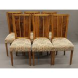 A set of six early 20th century oak and yew wood dining chairs. 45 cm wide.