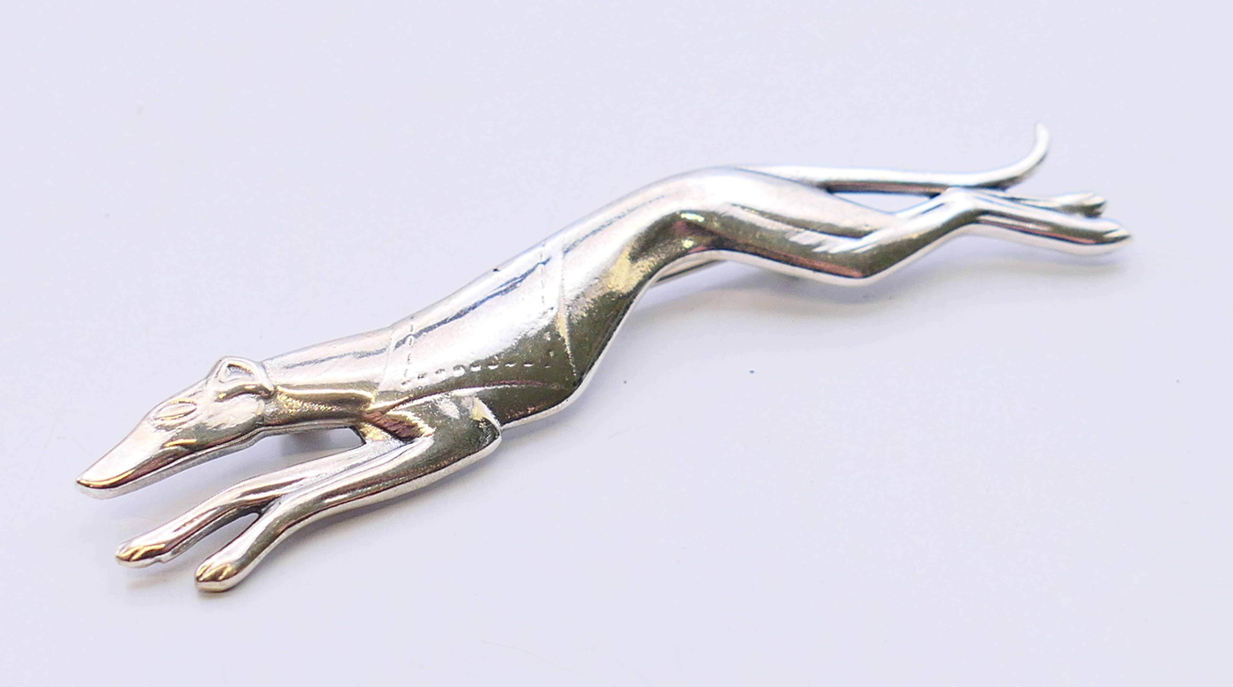 A silver brooch in the form of a greyhound. 7 cm long. - Image 2 of 4