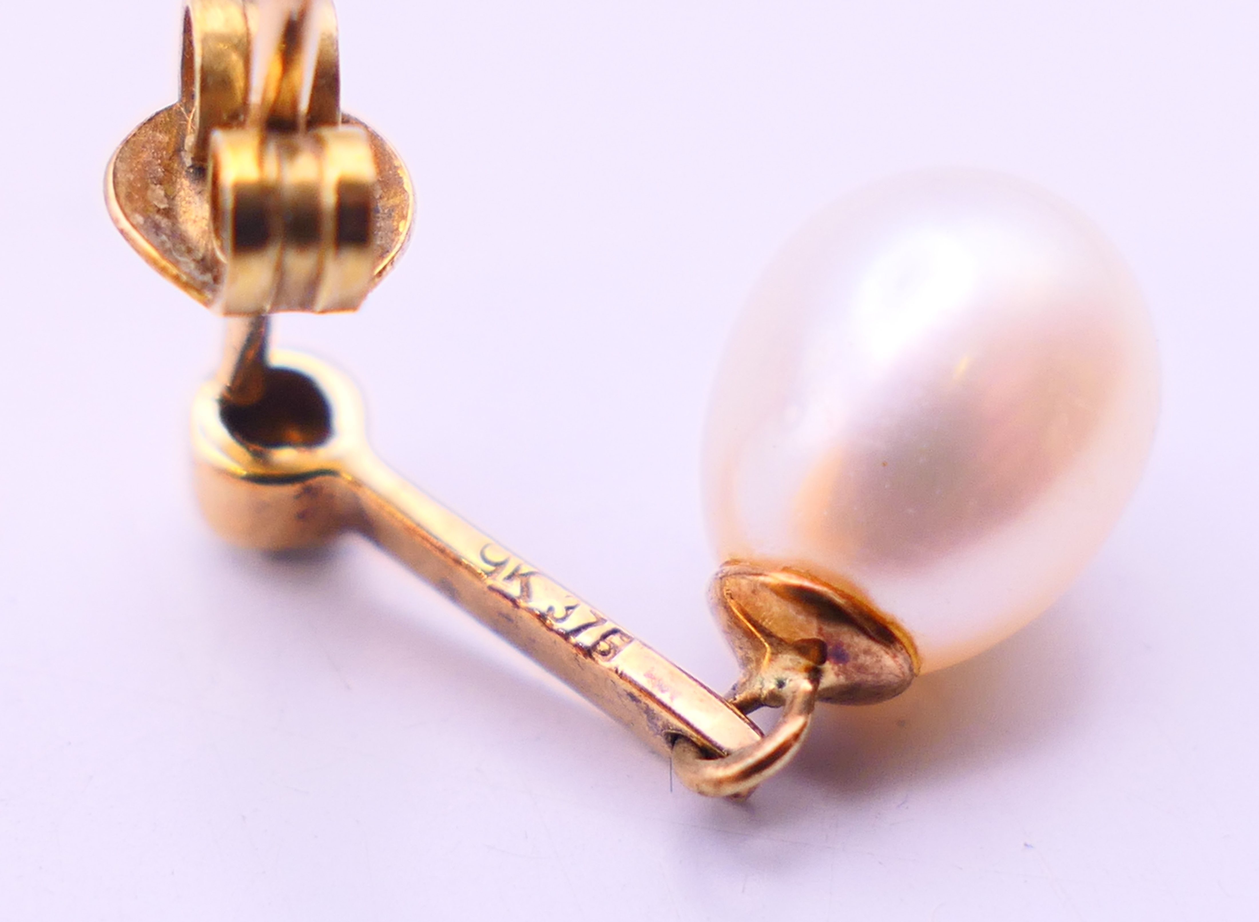 A pair of 9 ct gold, diamond and pearl earrings. 2 cm high. - Image 5 of 6