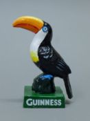 A cast iron Guinness toucan. 14.5 cm high.