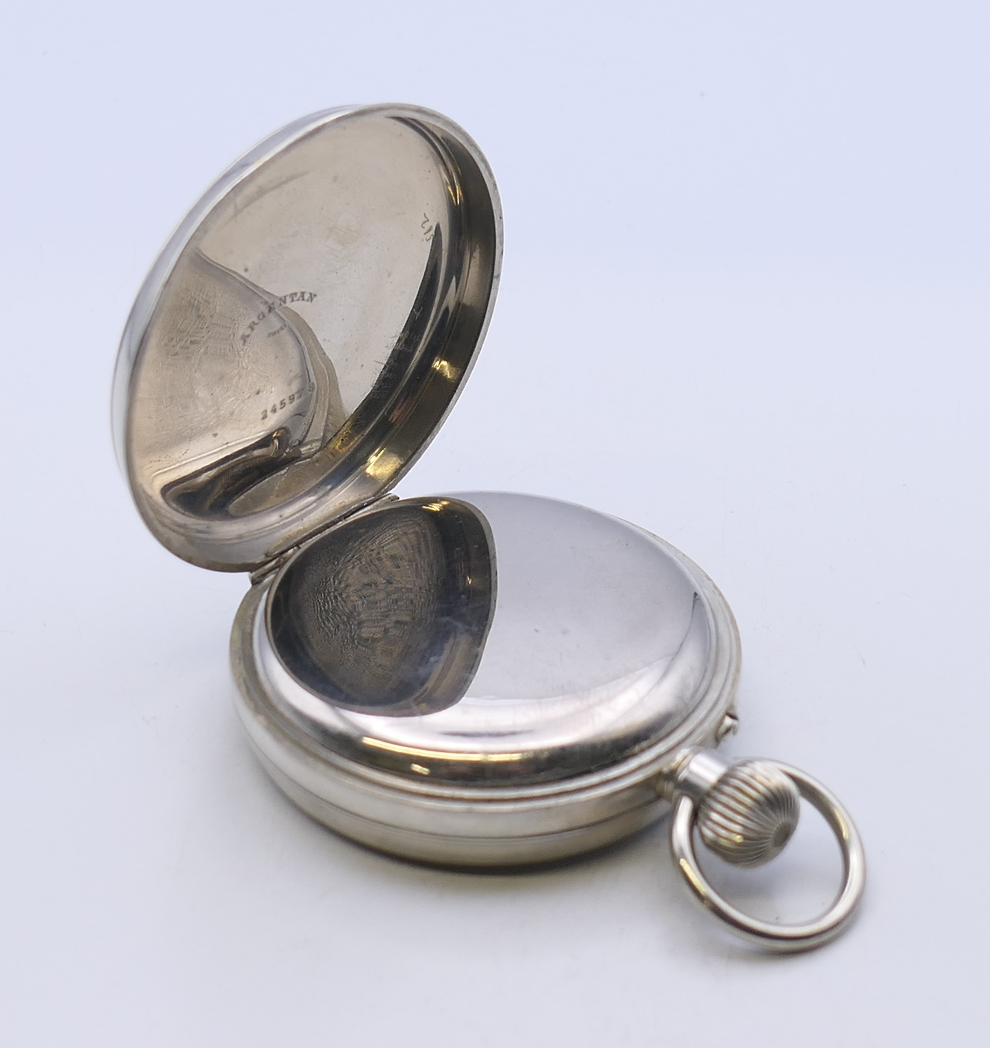 A Swiss silver plated Goliath pocket watch, housed in a silver-clad travelling case. - Image 6 of 9