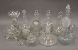A quantity of various cut glass items, including decanters. The largest 35 cm high.