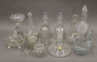 A quantity of various cut glass items, including decanters. The largest 35 cm high.