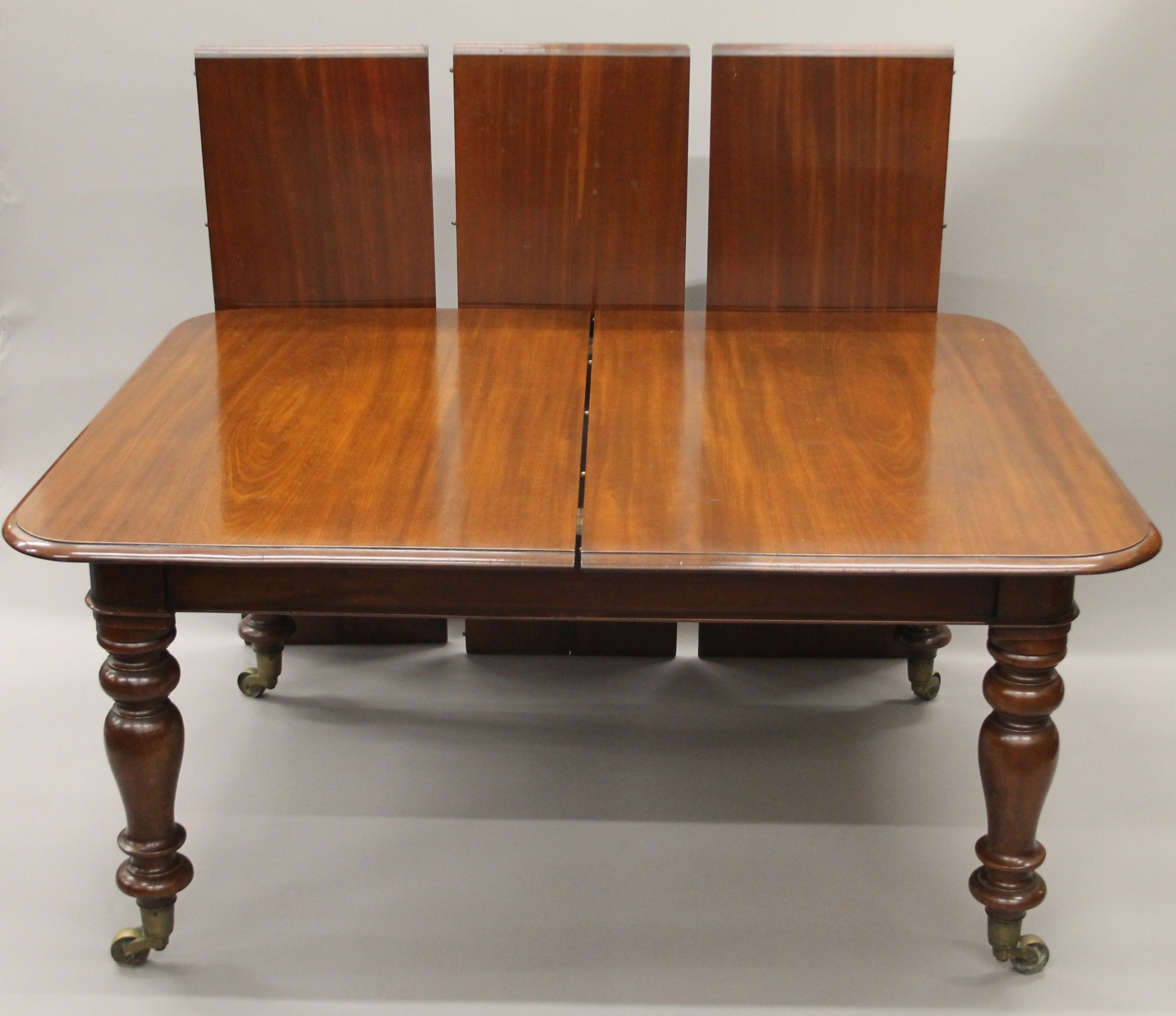 A 19th century mahogany three-leaf extending dining table.