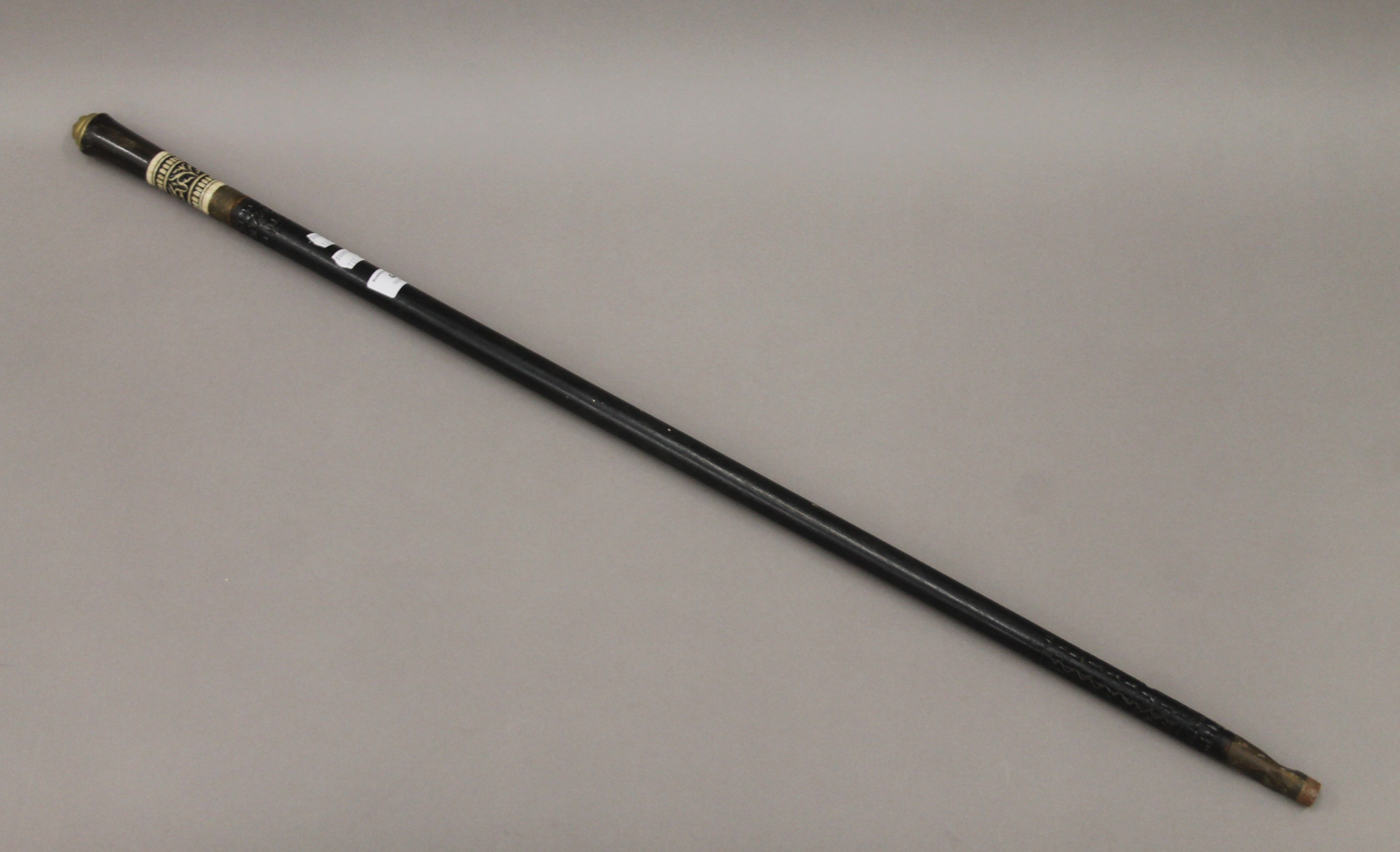 An Indian horn and bone handled sword stick. 90.5 cm long.