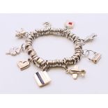 A silver Links of London charm bracelet. 90 grammes total weight. Approximately 18 cm long.