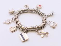 A silver Links of London charm bracelet. 90 grammes total weight. Approximately 18 cm long.