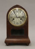 An early 20th century oak mantle clock. 31 cm high.