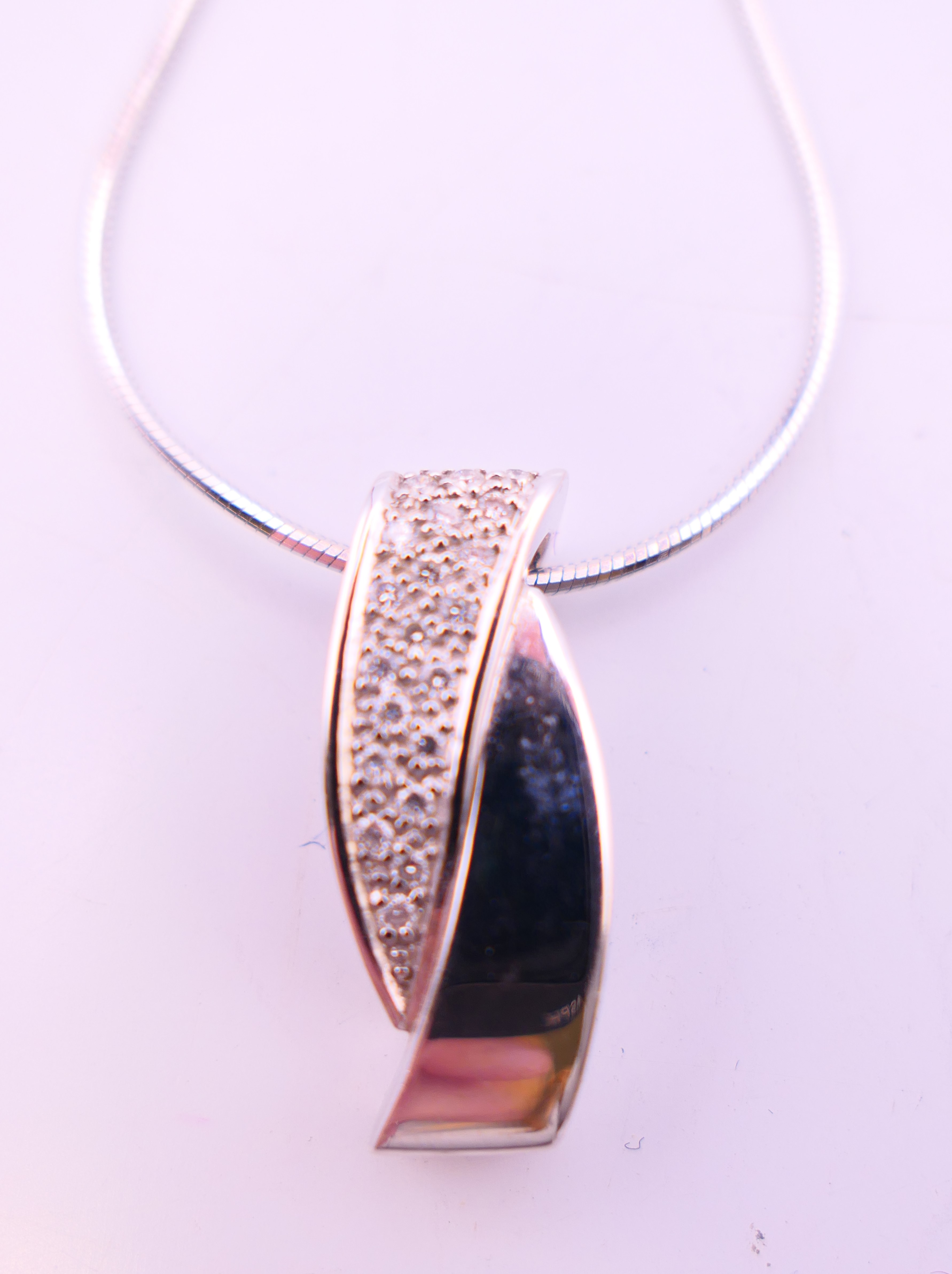 An 18 ct white gold and diamond pendant on an 18 ct white gold chain and a pair of 9 ct gold and - Image 4 of 13