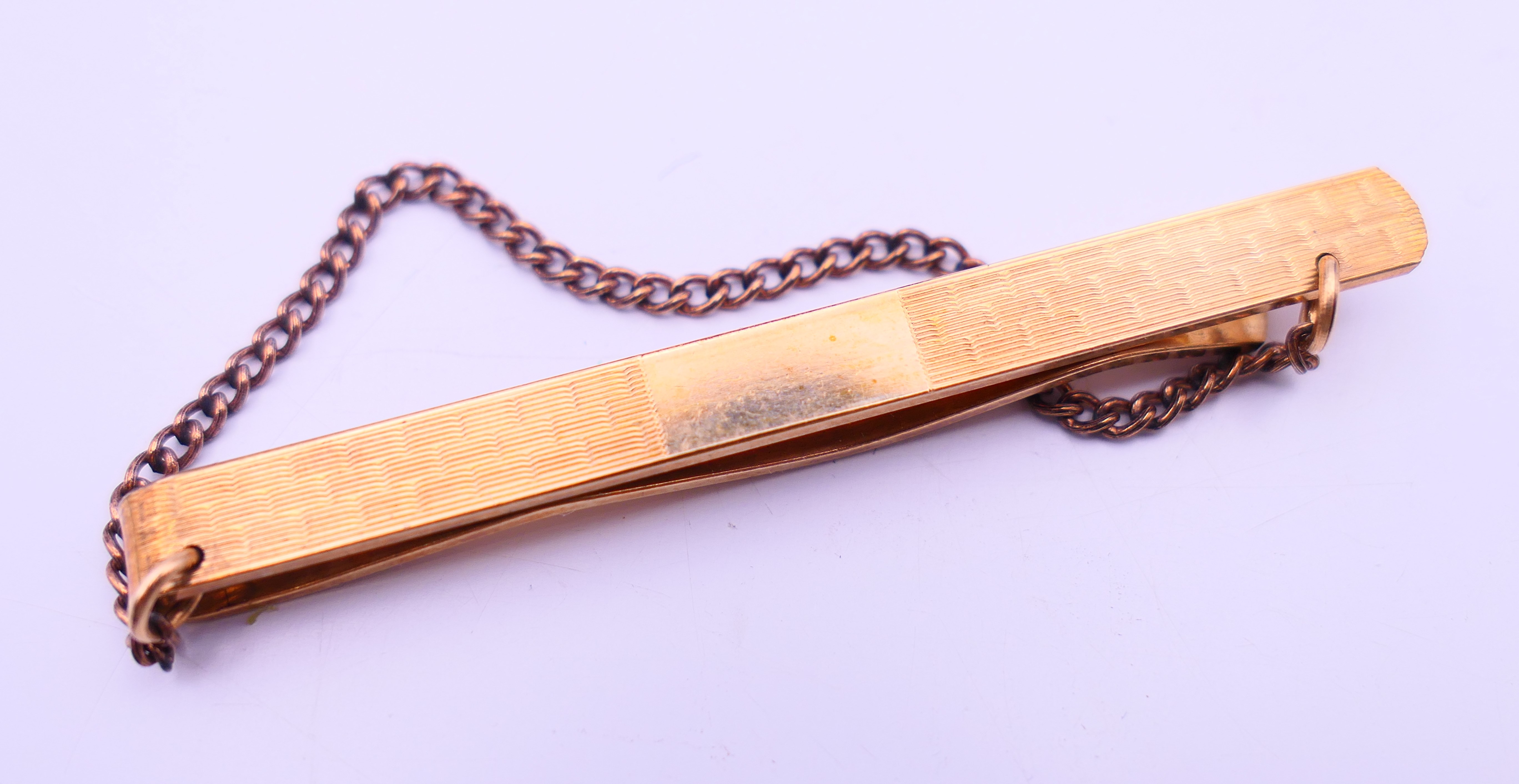 Three silver rings, a tie clip (1/20 9 ct gold) and part of a watch chain. Tie clip 6 cm long. - Image 4 of 7