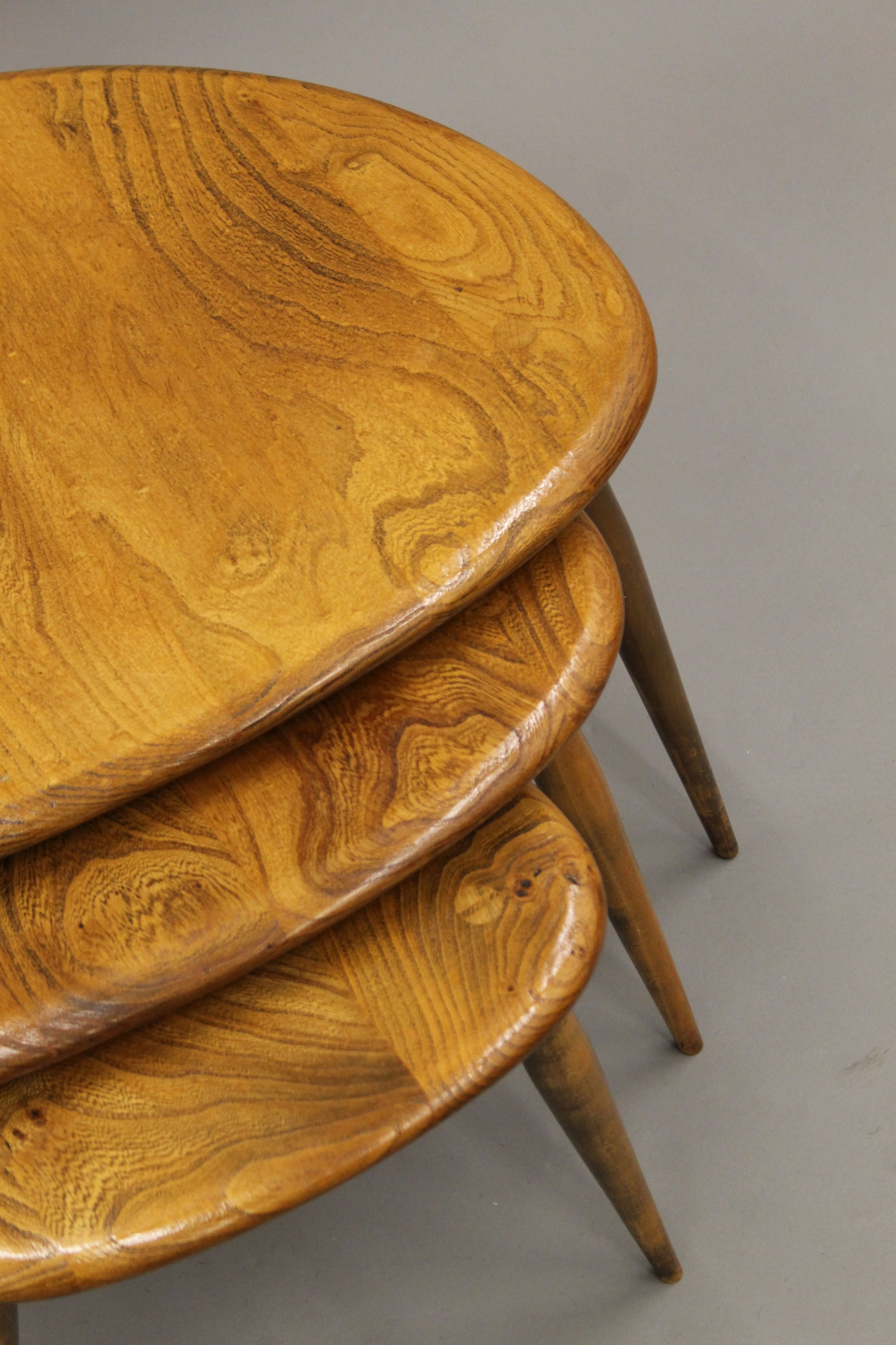 A nest of three Ercol pebble coffee tables. 46 cm wide. - Image 4 of 5