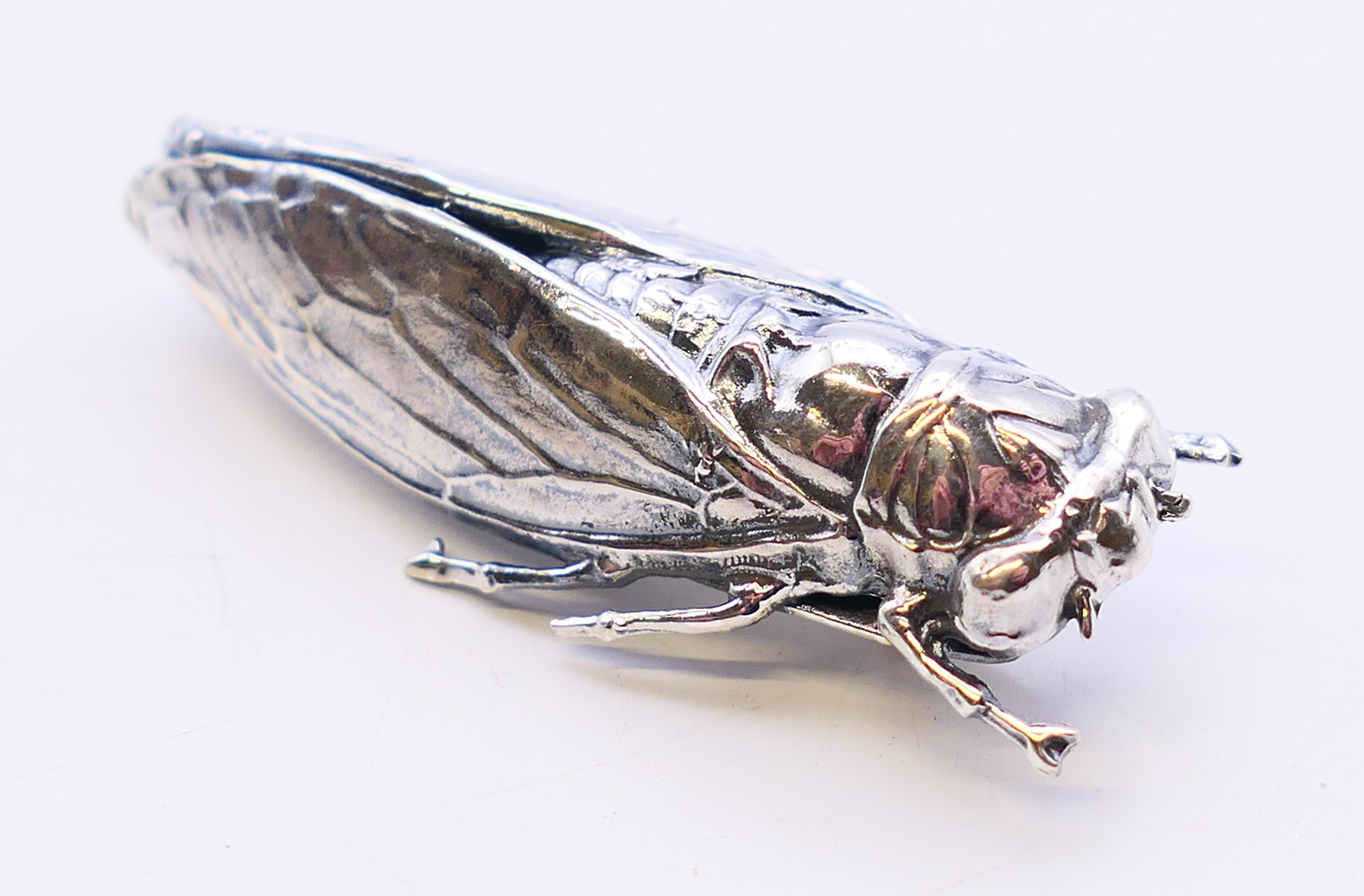 A silver brooch in the form of a beetle. 5 cm long. - Image 2 of 3
