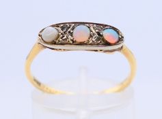 An opal and diamond ring. Ring size P/Q.
