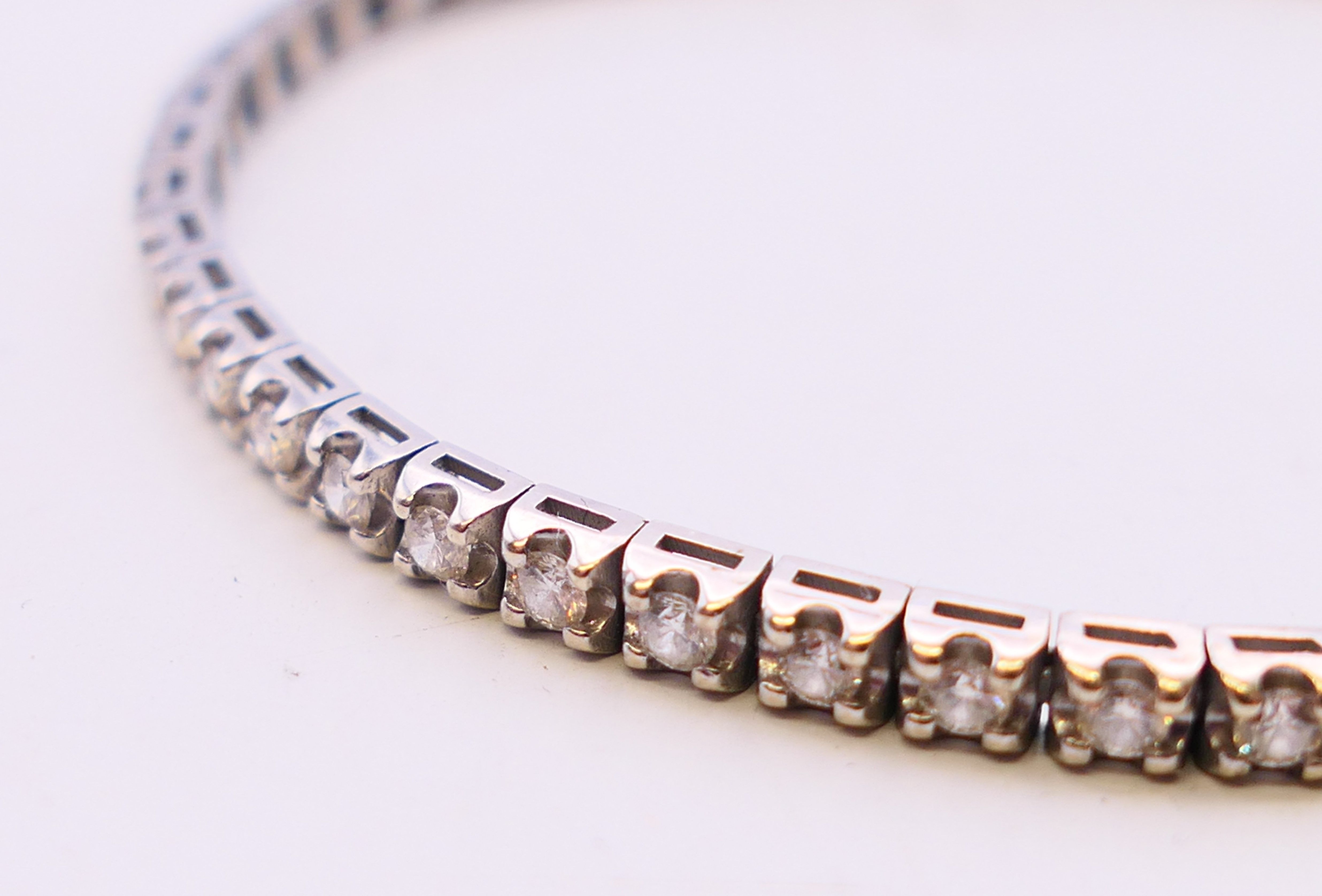A white gold and diamond line bracelet. 18 cm long. - Image 2 of 4