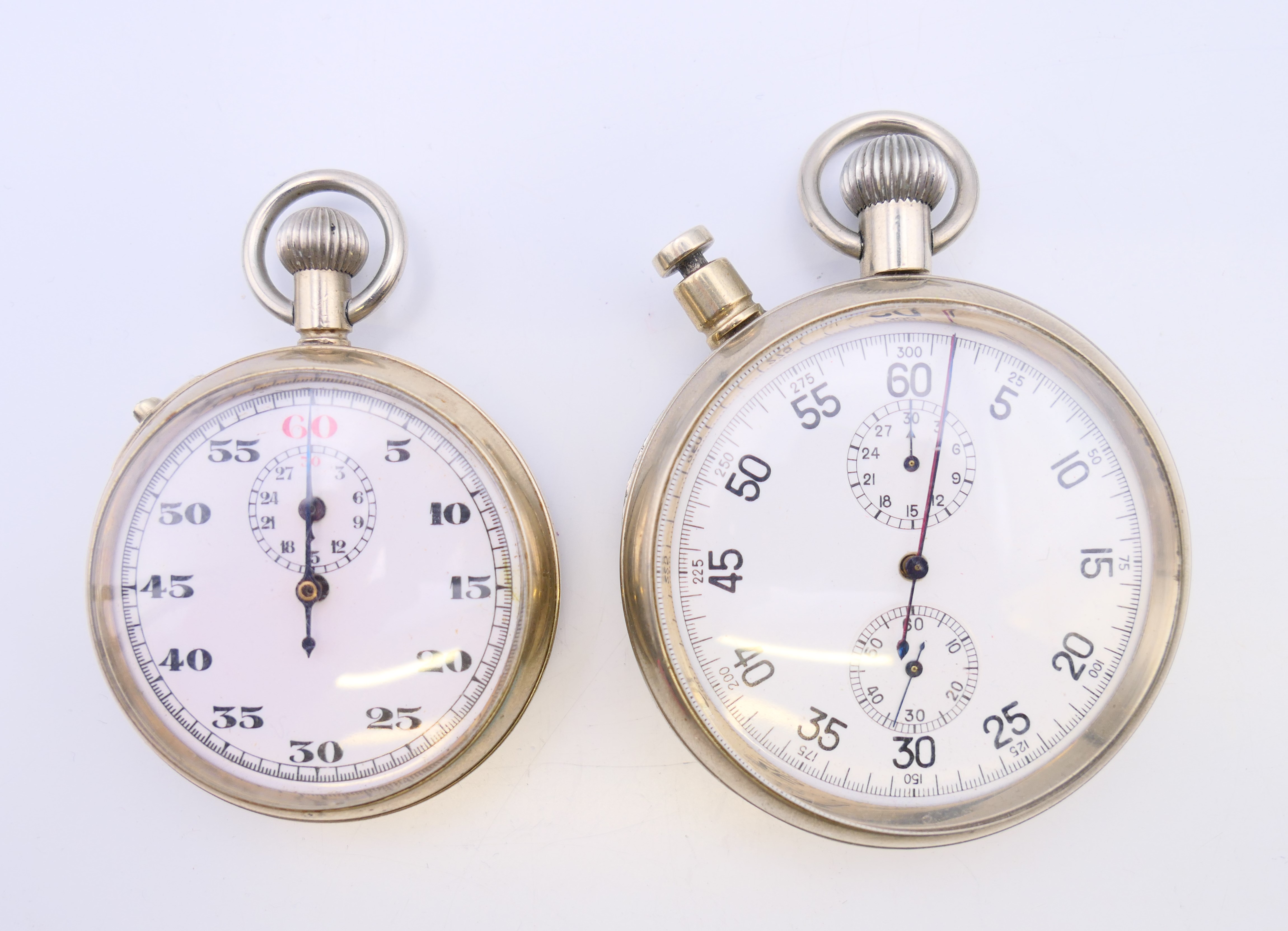 Two stopwatches: an Air Ministry 6B/129 split second stopwatch and a WWII military stopwatch,