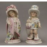 A 19th century Continental porcelain model of children inscribed Mama and Papa.