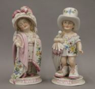 A 19th century Continental porcelain model of children inscribed Mama and Papa.