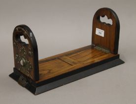 A Victorian Betjemann's brass and agate-mounted walnut sliding book rack. 34 cm long when closed.