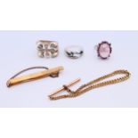 Three silver rings, a tie clip (1/20 9 ct gold) and part of a watch chain. Tie clip 6 cm long.