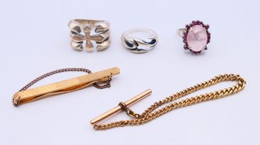 Three silver rings, a tie clip (1/20 9 ct gold) and part of a watch chain. Tie clip 6 cm long.