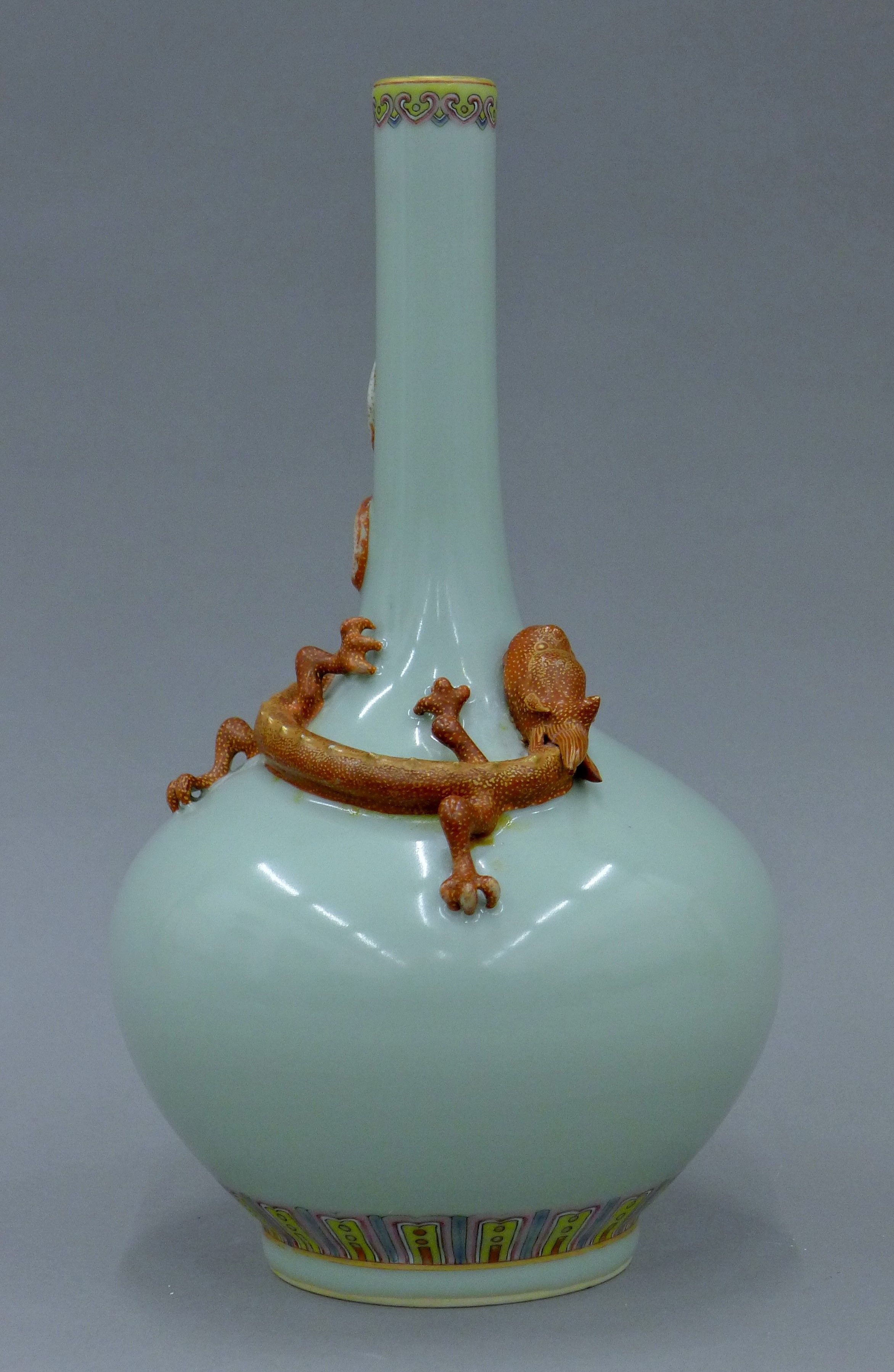 A Chinese celadon ground porcelain bottle vase decorated with a dragon. 30 cm high. - Image 2 of 6